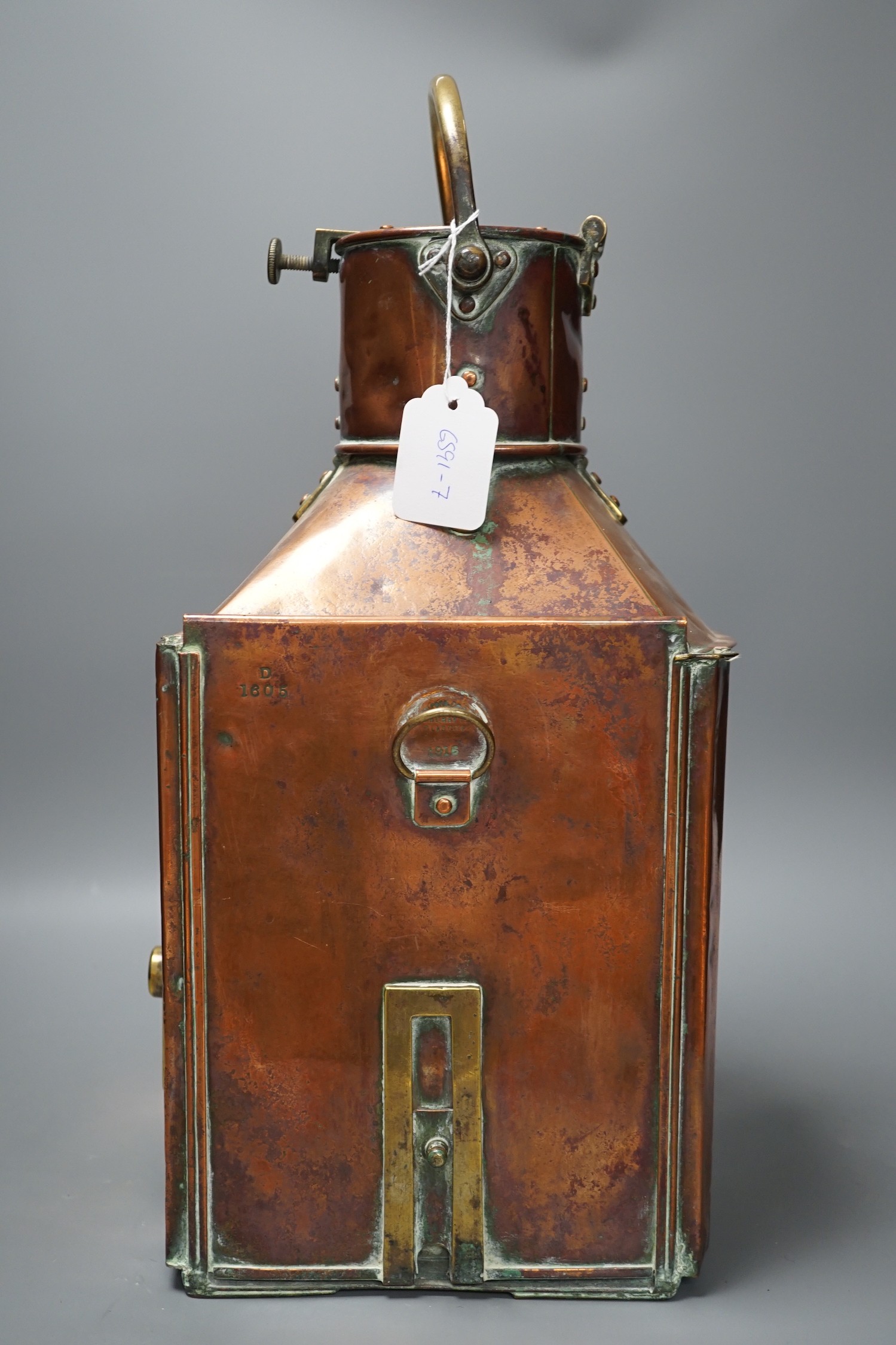 A copper ship’s port lamp, manufactured by Telford.Grier & Mackay, Glasgow, 1918, 42 cms high